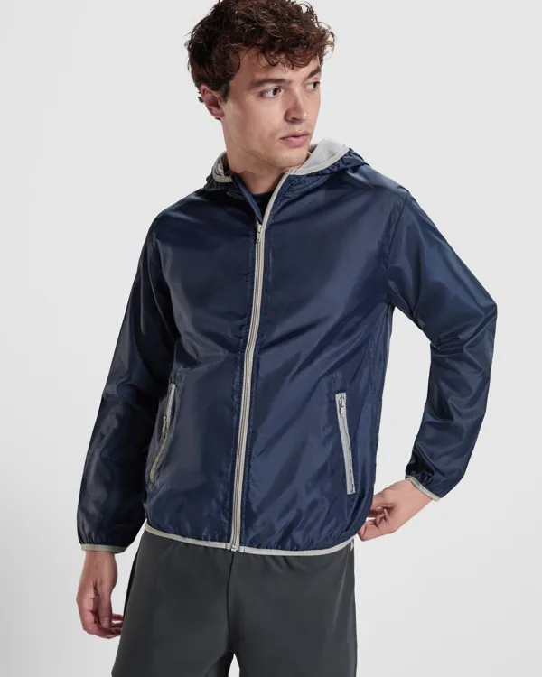 Unisex αθλητικό μπουφάν Roly Angelo 5088 σε μπλε σκούρο χρώμα, με εκτύπωση λογοτύπου