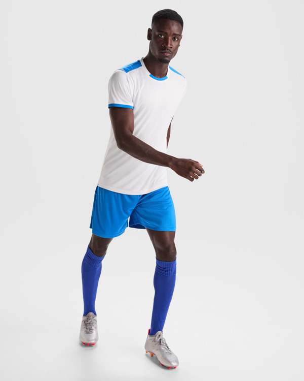 Unisex αθλητική εμφάνιση Roly Racing 0452 σε λευκό/ρουά χρώμα, με εκτύπωση λογοτύπου